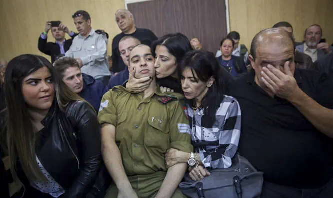 Elor Azariya sits with his family as verdict handed down