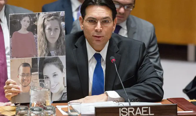 Danon with the pictures of the murdered soldiers